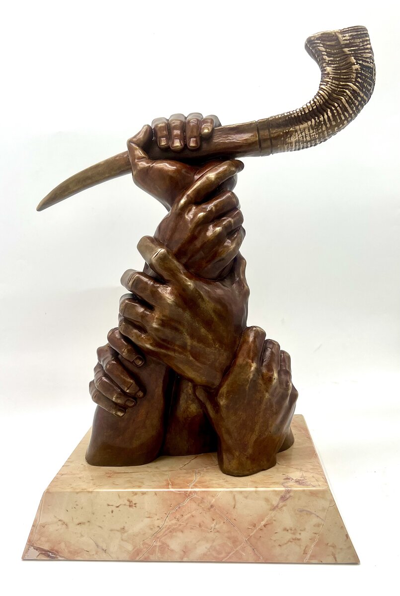 Bronze sculpture of intertwined hands lifting a shofar, inspired by The Great Shofar painting