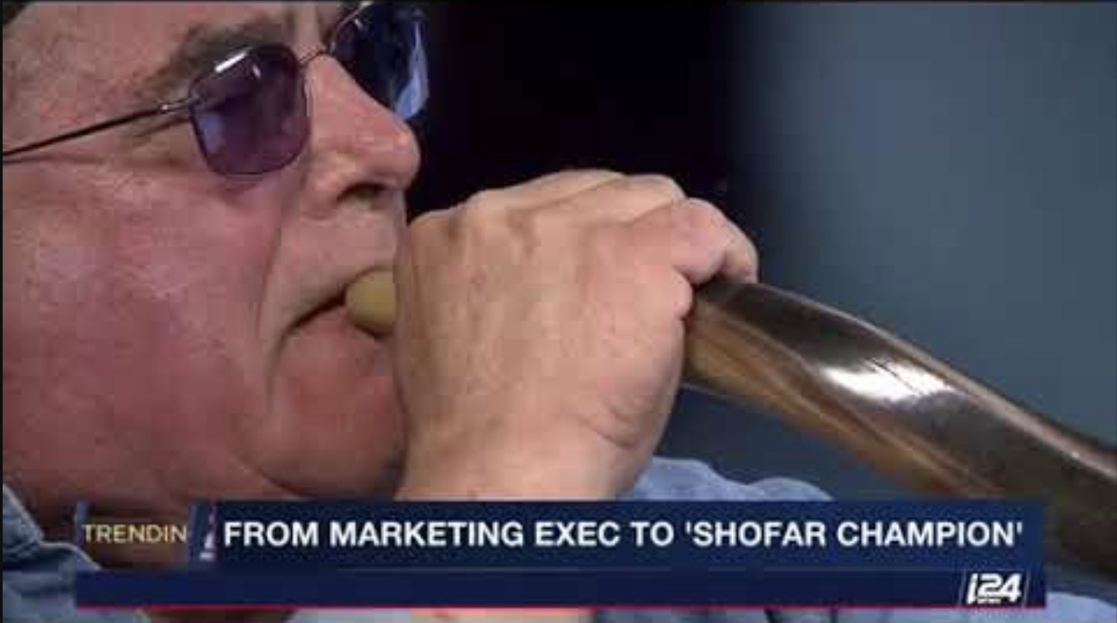 Robert Weinger in a television interview on i24 TV discussing shofar traditions during Yom Kippur